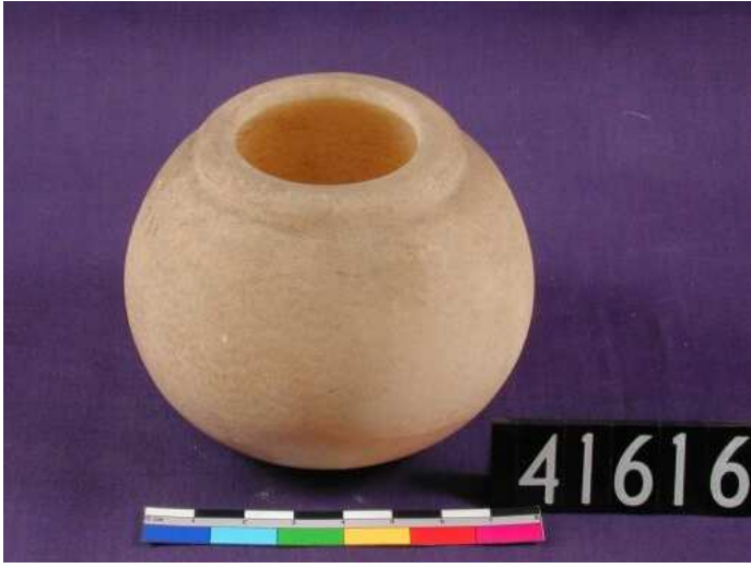  
spherical sandstone vase on purple ground 